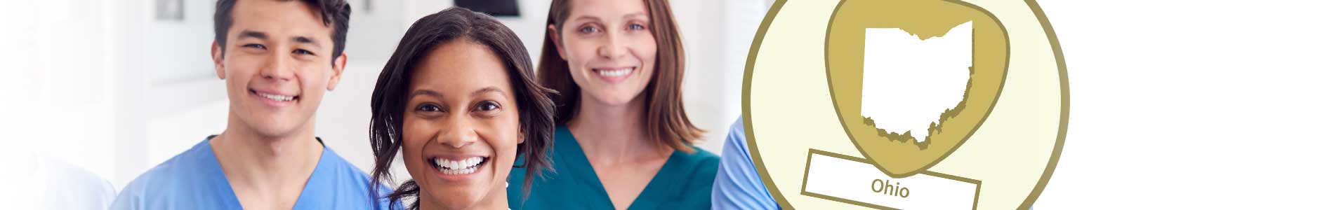 Young female nurse with face mask around her neck and young male nurse in blue scrubs, both smiling and Ohio state outline